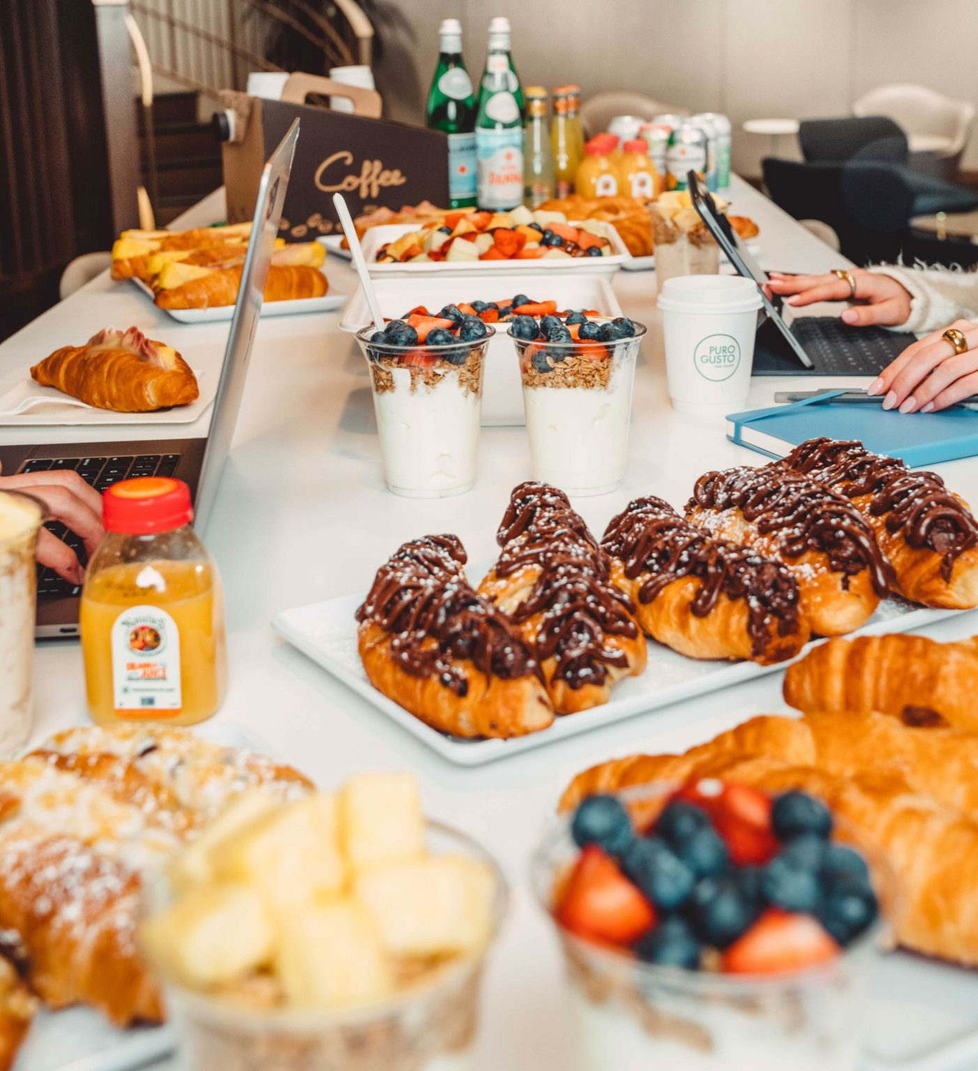 Table shot of a variety of breakfast foods and drinks.